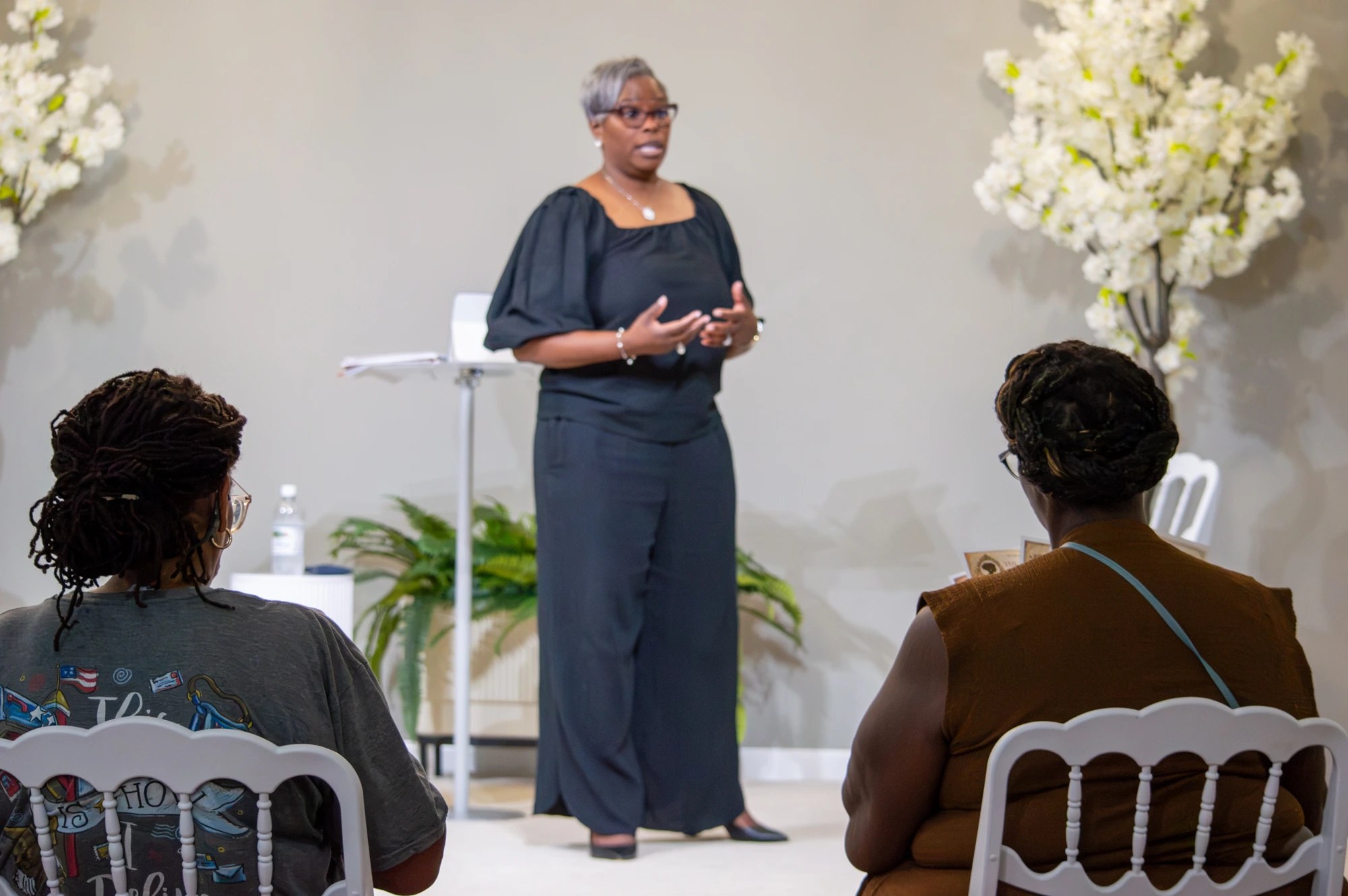 Sharron Debnam speaking to women seated in the audience
